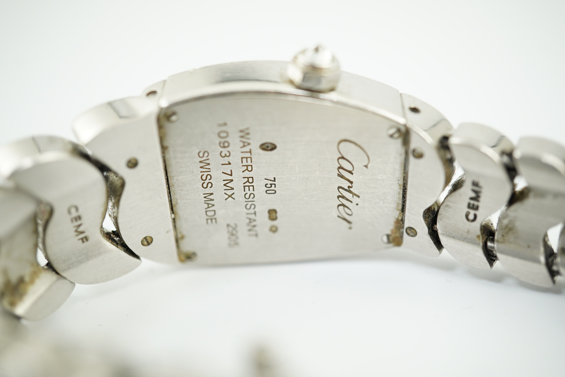 A lady's recent 18ct white gold and diamond set Cartier La Dona quartz wrist watch, on an 18ct white gold Cartier bracelet